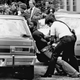 FILE - In this May 18, 1979 file photo, police handcuff a suspect during a drug raid in Miami. Police said eight were arrested and marijuana was seized. On the occasion of Legalization Day, Thursday, Dec. 6, 2012, when Washingtons new law takes effect, AP takes a look back at the cultural and legal status of the evil weed in American history. (AP Photo/Al Diaz, File)